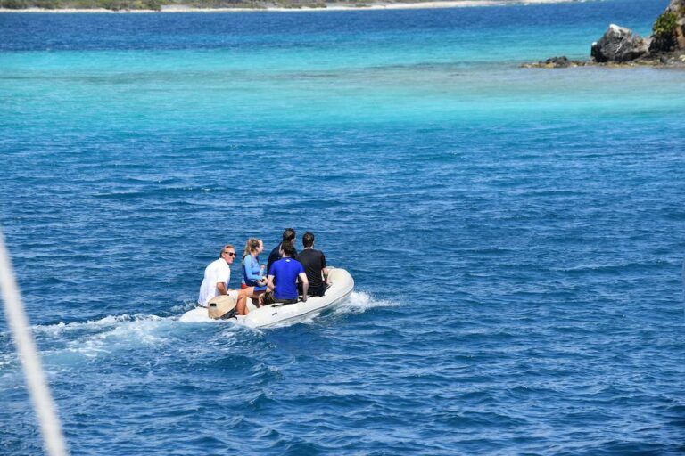 Guests on a speed boat heading toward an island during a private yacht charter vacation in St Johns, Virgin Islands